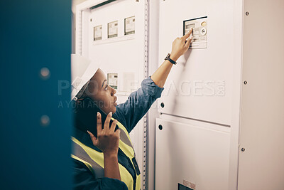 Buy stock photo Black woman, electrical technician or phone call in control room for engineering system, electricity or maintenance service. Female electrician talking on mobile tech, check industrial board or power