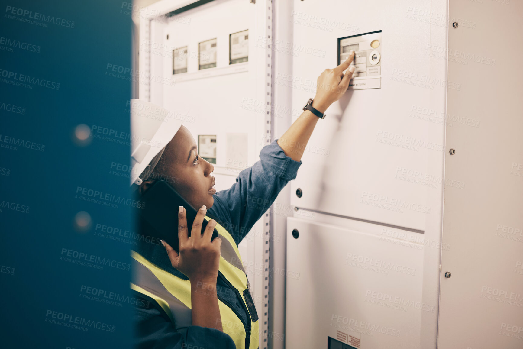 Buy stock photo Black woman, electrical technician or phone call in control room for engineering system, electricity or maintenance service. Female electrician talking on mobile tech, check industrial board or power