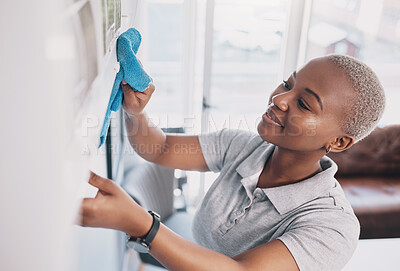 Buy stock photo Cleaning, happy and dust with black woman in living rom for housekeeping, hygiene and disinfection. Janitor, hospitality and cloth with cleaner and washing in home for germ, bacteria and sanitary 