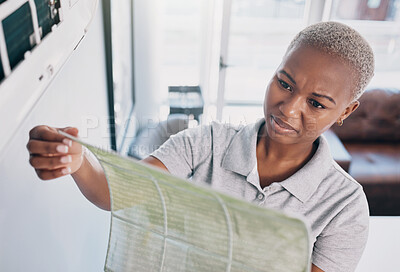 Buy stock photo Dirty, cleaning and a black woman with a wall cover for maintenance, building or home renovation. Dust, construction and an African girl or cleaner with a trash, waste or garbage problem in a house