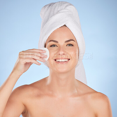 Buy stock photo Bathroom, studio portrait and happy woman with cotton pad for skincare cleaning, self care or foundation. Beauty, face or person with hygiene, wellness and makeup removal product on blue background