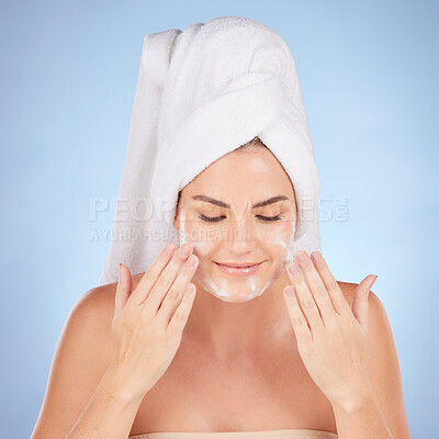 Buy stock photo Shower, woman and washing face with foam in studio, blue background and cleaning cosmetics. Happy female model, facial skincare and soap for healthy aesthetic glow, dermatology or moisturizing beauty