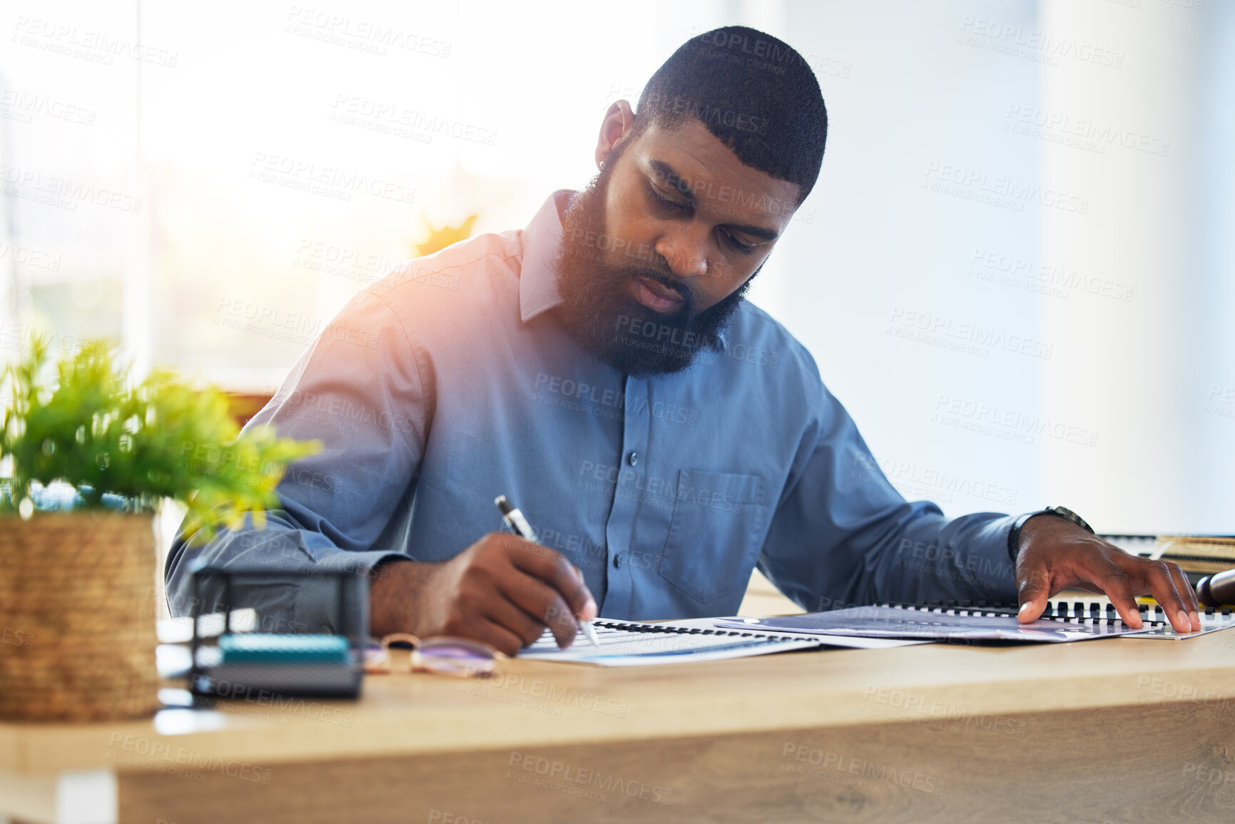 Buy stock photo Business, planning and black man writing, brainstorming and schedule for project, contract and ideas. Male person, lawyer and employee with a notebook, focus and strategy for company development