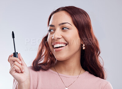 Buy stock photo Smile, beauty or happy girl with mascara makeup, cosmetics or product brush laughing in studio. Woman, face or female model with eyelashes tool for grooming, glamour or self care on white background