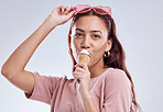 Fashion, ice cream and portrait of woman with cone in studio with dessert, snack and sweet treats. Happy, fashion and face of female person with sunglasses in trendy accessories, style and cosmetics