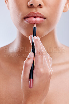 Buy stock photo Hand, lips and pencil, woman and beauty with cosmetic product and makeup closeup isolated on white background. Female model, lipstick lipliner application and skin with cosmetology in a studio