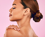 Face, profile and beauty, woman and skincare with natural cosmetics and shine isolated on pink background. Female model, health skin glow and dermatology with wellness, self love and makeup in studio