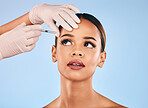 Eyebrow, injection and beauty, woman and cosmetic surgery  and dermatology isolated on blue background. Face, skincare and syringe, female model and doctor hands with liquid collagen in studio