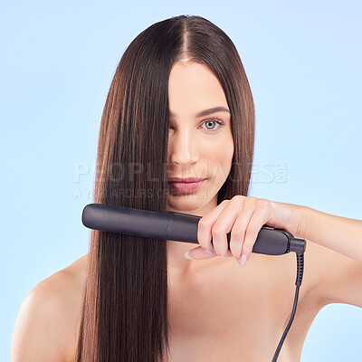 Buy stock photo Portrait, woman and hair iron for beauty in studio, cosmetic treatment or shine on blue background. Face of female model, haircare and heating equipment of electric tools, smooth texture or aesthetic
