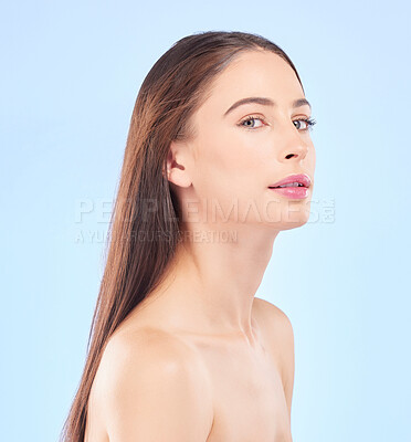Buy stock photo Portrait, beauty and hair with a model woman in studio on a blue background for skincare or keratin treatment. Spa, salon and haircare with a young female person posing for shampoo promotion