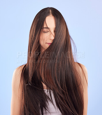 Buy stock photo Luxury, texture and woman with hair care, cosmetics and wellness against a blue studio background. Female person, aesthetic and model with volume, wavy and scalp treatment with self care and beauty