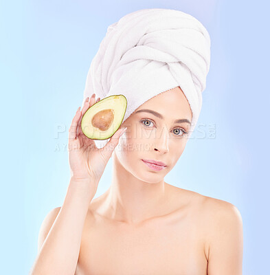 Buy stock photo Woman, portrait and avocado, natural beauty and vitamin c with sustainable skincare isolated on blue background. Face, female model with fruit and eco friendly dermatology, cosmetic care in studio