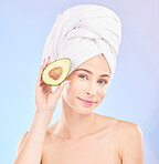 Skincare, beauty and portrait of woman with avocado, makeup and facial detox with smile on blue background. Health, wellness and sustainability, model with luxury vitamin cleaning and towel on head.