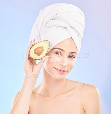 Buy stock photo Skincare, beauty and portrait of woman with avocado, makeup and facial detox with smile on blue background. Health, wellness and sustainability, model with face cleaning and towel on head in studio.