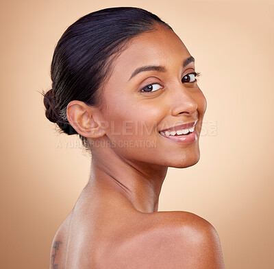Buy stock photo Portrait, beauty or happy woman with natural facial glow with dermatology skincare cosmetics in studio. Face, brown background or aesthetic Indian girl model smiling with , wellness or self love 