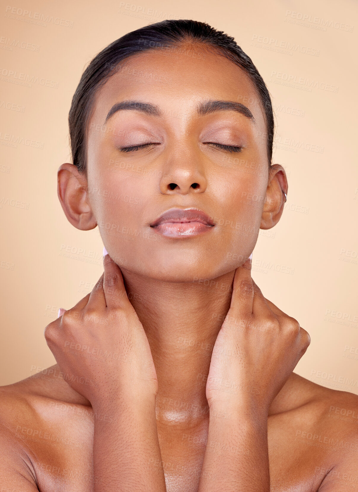 Buy stock photo Self care, beauty and Indian woman with cosmetics, glow and dermatology against a brown studio background. Female person, aesthetic and model with wellness, bare and shine with makeup and skincare