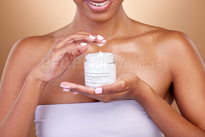 Buy stock photo Cream, container and woman hands for skincare, beauty and cosmetics application on brown background. Happy person or skin care model with body lotion or moisturizer for dermatology health in studio