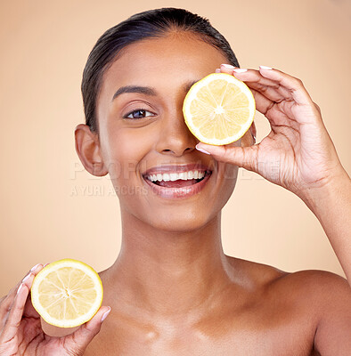 Buy stock photo Lemon, portrait ad natural skincare of woman in studio for vitamin c benefits, eco cosmetics and nutrition. Face of indian female model, healthy beauty or citrus fruit for aesthetic vegan dermatology