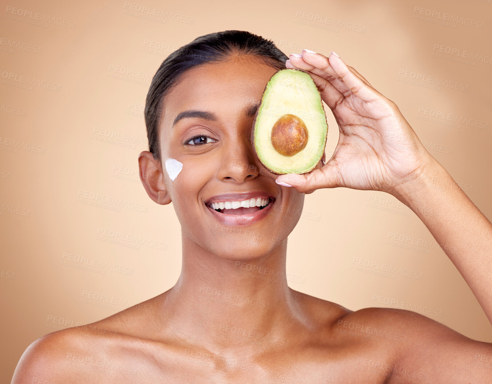 Buy stock photo Avocado, cream and beauty with portrait of woman in studio for product, skincare and natural cosmetics. Spa, facial and lotion with face of model on brown background for vitamin c and self care