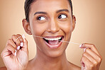 Woman, dental floss and studio for thinking, smile and cleaning for teeth whitening by brown background. Girl, model or happy for dentistry product, ideas or self care for cosmetic, beauty or health