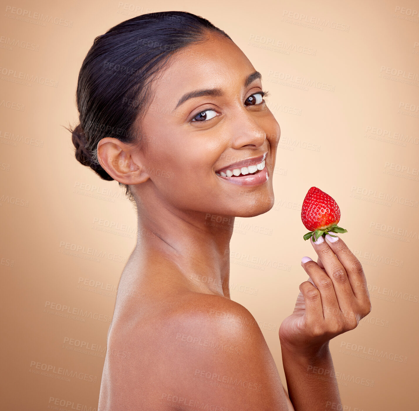 Buy stock photo Portrait, woman with a strawberry and skincare with natural beauty in studio or benefits in healthy nutrition, diet or fruit. Girl, eating or food with vitamin c for skin to glow or wellness of body
