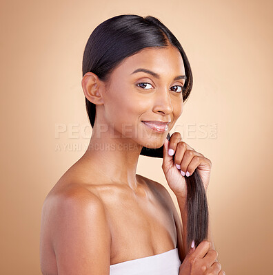 Buy stock photo Portrait, hair care and Indian woman, with beauty, cosmetics and dermatology against a brown studio background. Face, female person or model with luxury, shine and glow with volume, growth or texture