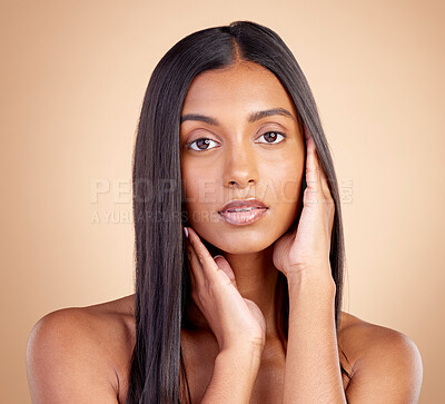 Buy stock photo Portrait, hair care and Indian woman with cosmetics, makeup and skincare on a brown studio background. Face, female person and model with volume, texture and scalp treatment with natural beauty