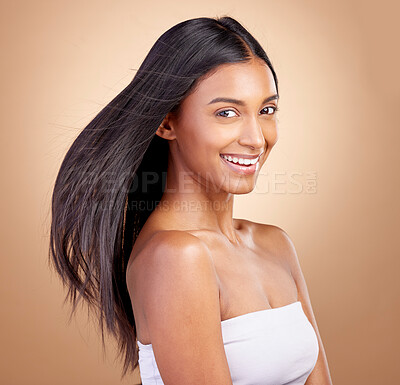Buy stock photo Hairstyle, salon and beauty with indian woman healthy shine in brown studio background. Haircare, girl and happy with wind for growth or keratin treatment with shine and natural cosmetic in mockup.