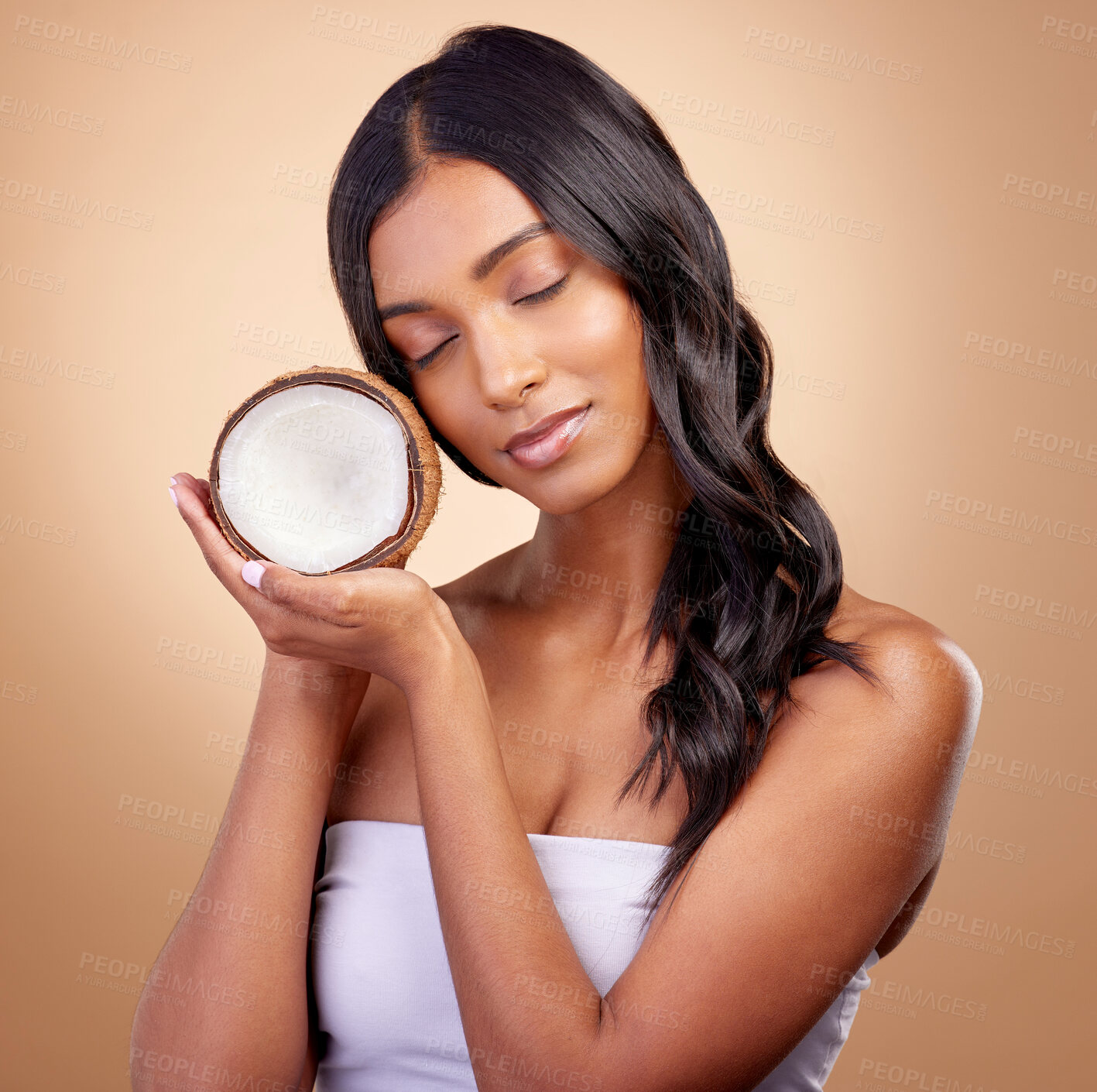 Buy stock photo Coconut, fruit and woman with natural beauty, skincare or vegan product in cosmetics for healthy skin glow, shine or benefits. Tropical fruits, Indian model and organic oil for cosmetic cream