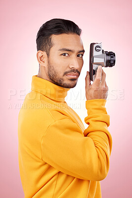 Buy stock photo Portrait, man and retro camera for creative photography or taking a picture for art, travel or record of a memory. Serious, creative photographer and shooting on vintage film technology in studio