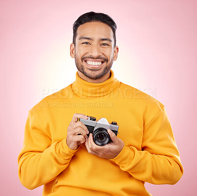 Buy stock photo Portrait, photographer with a camera and smile for photography, taking picture for art or travel as cameraman with a happy memory. Creative man on studio background, shooting on retro or vintage film