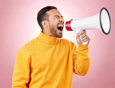 Buy stock photo Asian man, megaphone and screaming for discount, sale or alert against a pink studio background. Male person shouting for advertising, marketing or announcement in notification, voice or protest