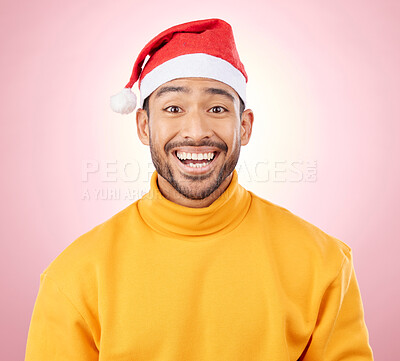 Buy stock photo Portrait, surprise and happy man with Christmas hat, fun and festive for holiday on pink background. Happiness, shock and excited model with smile, santa cap and winter vacation fashion in studio.