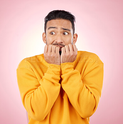 Buy stock photo Anxiety, thinking and asian man biting nails in studio with terror, fear and scared for drama on pink background. Stress, gossip and wtf by male person with horror, fake news or worried about secret