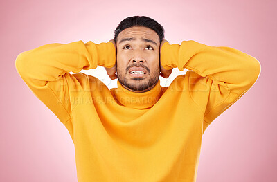 Buy stock photo Headache, stress and asian man in studio with depression, tinnitus or brain fog on pink background. Anxiety, migraine and Japanese guy in crisis, mistake or fail, vertigo or frustrated by noise
