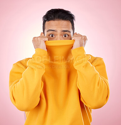 Buy stock photo Eyes, hiding and portrait of man in studio with shocking, fashion and bad news of horror or terror on pink background. Shy, face and person covering anxiety or scared reaction to fear and stress