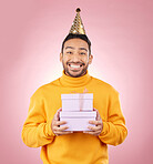 Man, portrait and present for birthday party, prize and giveaway celebration or success on pink background. Excited asian person or winner with gift boxes for retail competition or sale in studio