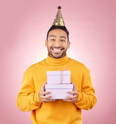 Buy stock photo Man, portrait and present for birthday party, prize and giveaway celebration or success on pink background. Excited asian person or winner with gift boxes for retail competition or sale in studio