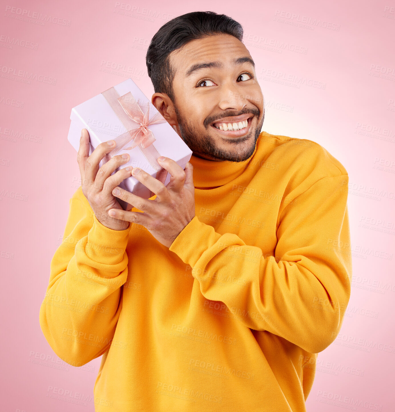 Buy stock photo Man, winner and gift box, birthday celebration and prize, excited giveaway or shopping on pink background. Happy person thinking of present, ribbon package and retail sale or competition in studio