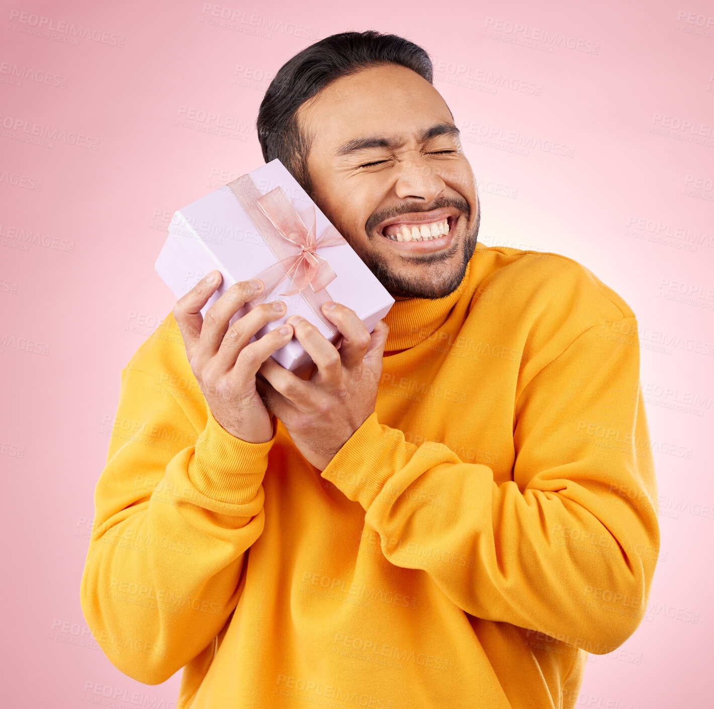 Buy stock photo Man, excited winner and gift box, birthday celebration and prize, giveaway or shopping on pink background. Happy person with present, ribbon package and retail sale or competition love in studio