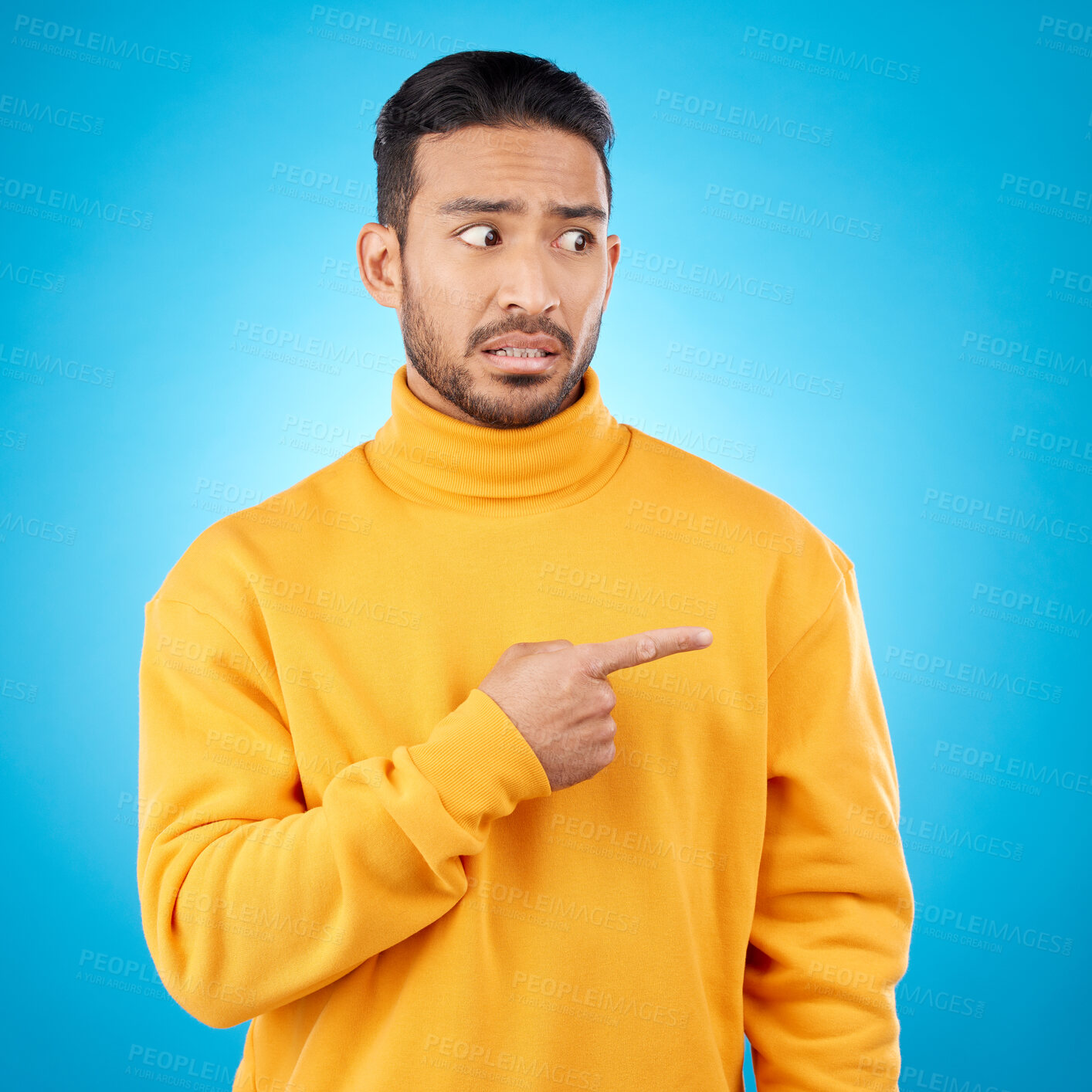 Buy stock photo Wtf, surprise and asian man hand pointing in studio for menu, questions and how to steps on blue background. Omg, doubt and male face with finger show feedback, schedule or presentation with anxiety