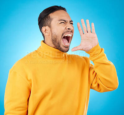 Buy stock photo Announcement, hand and young man isolated on blue background for scholarship, sale or university broadcast. Shout, voice and opinion of person or student with college news or attention in studio