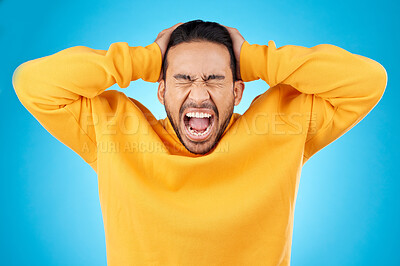 Buy stock photo Angry, man and face with screaming in studio with burnout, anxiety and stress. Isolated, blue background and frustrated by problem with male person yelling and mental health from mistake and issue