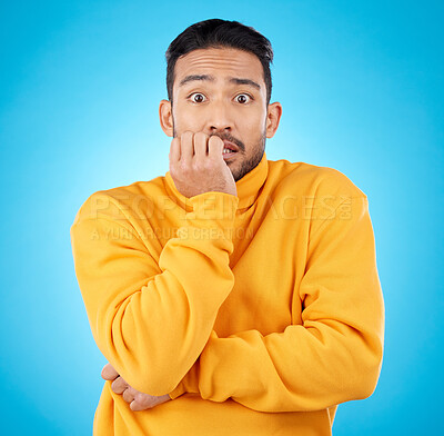 Buy stock photo Anxiety, portrait and asian man biting nails in studio with stress, suspense or crisis on blue background. Face, worry and nervous male with emoji reaction to news, gossip or did you know drama
