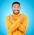 Happy, asian man and hands pointing in studio for choice, deal or sign up decision on blue background. Smile, direction and Japanese guy with recommendation, suggestion or coming soon launch platform