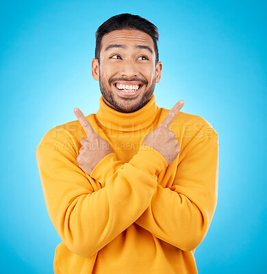 Buy stock photo Happy, asian man and hands pointing in studio for choice, deal or sign up decision on blue background. Smile, direction and Japanese guy with recommendation, suggestion or coming soon launch platform