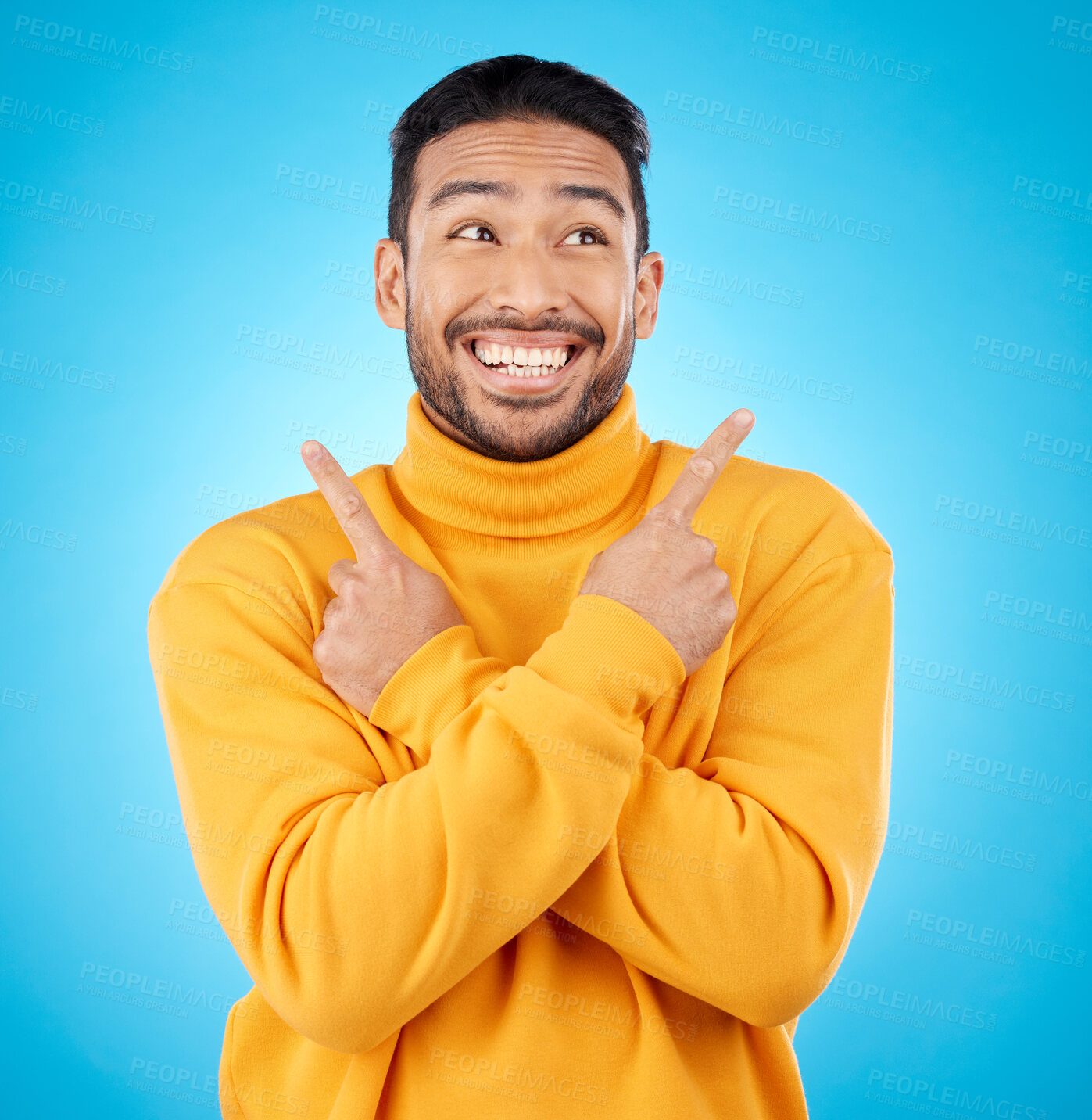 Buy stock photo Happy, asian man and hands pointing in studio for choice, deal or sign up decision on blue background. Smile, direction and Japanese guy with recommendation, suggestion or coming soon launch platform