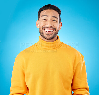 Buy stock photo Laugh, portrait and happy asian man in studio with humor, joke or funny smile reaction on blue background. Comedy, face and Japanese guy model, free emotion or good mood, vibes or positive attitude