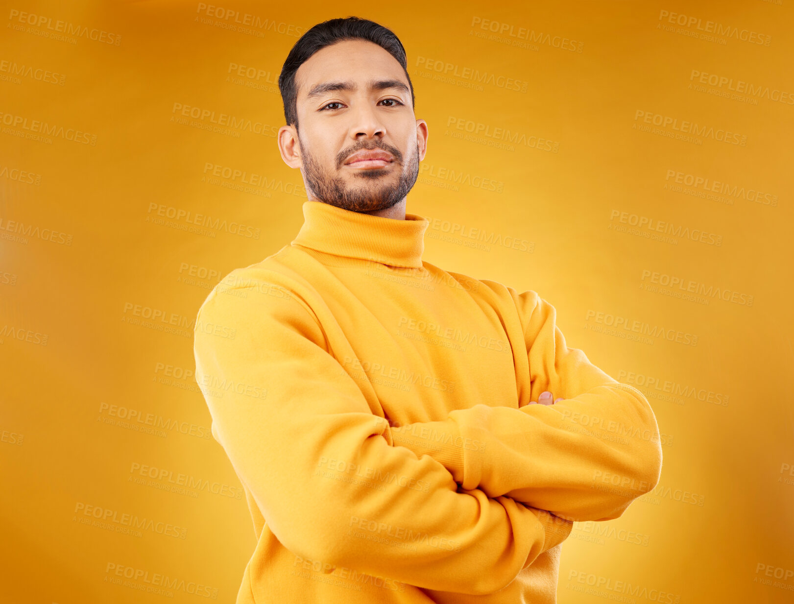 Buy stock photo Fashion, winter and portrait of man with arms crossed for style, cool and trendy aesthetic. Yellow, handsome and Asian person or model with confidence, pride and power on a studio background
