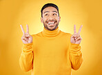 Peace, hands and happy asian man in studio with thank you, vote or feedback on yellow background. V, sign and Japanese male model with emoji fingers, smile and good mood, vibes or positive attitude
